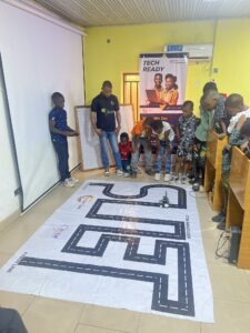 students operating the robots they built